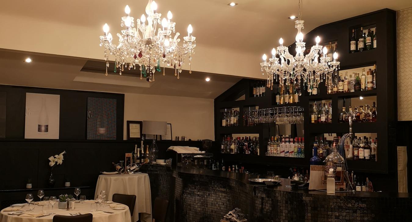 Restaurant/bar area with beautiful chandelier installation