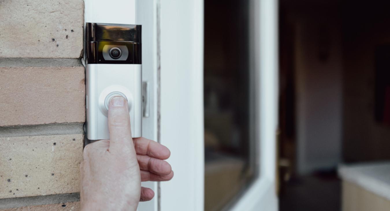 Smart doorbell, hand pressing button, open door to the house